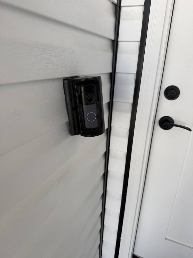Smart video doorbell installed on siding